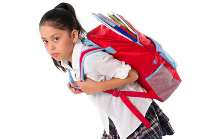 child_wearing_heavy_school_bag
