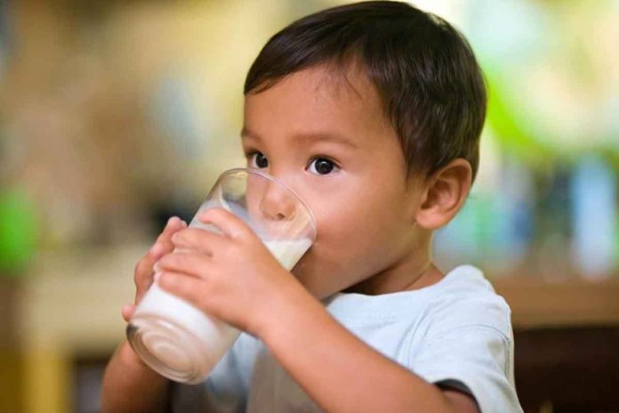 child-drinking-glass-of-milk-before-sleep